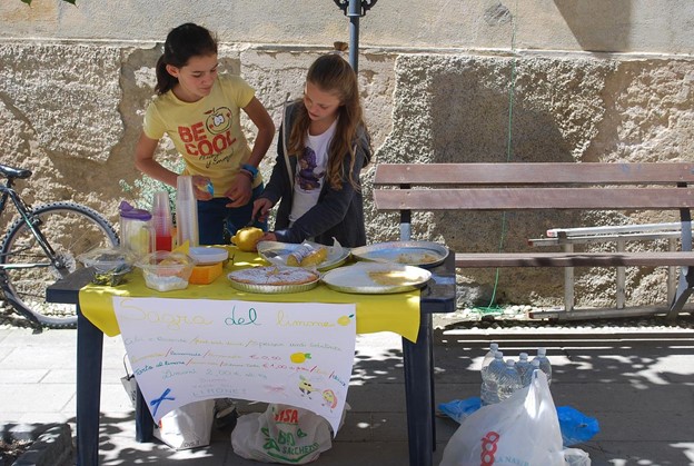 Two girls are selling food