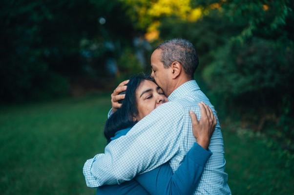 Female and male hugging