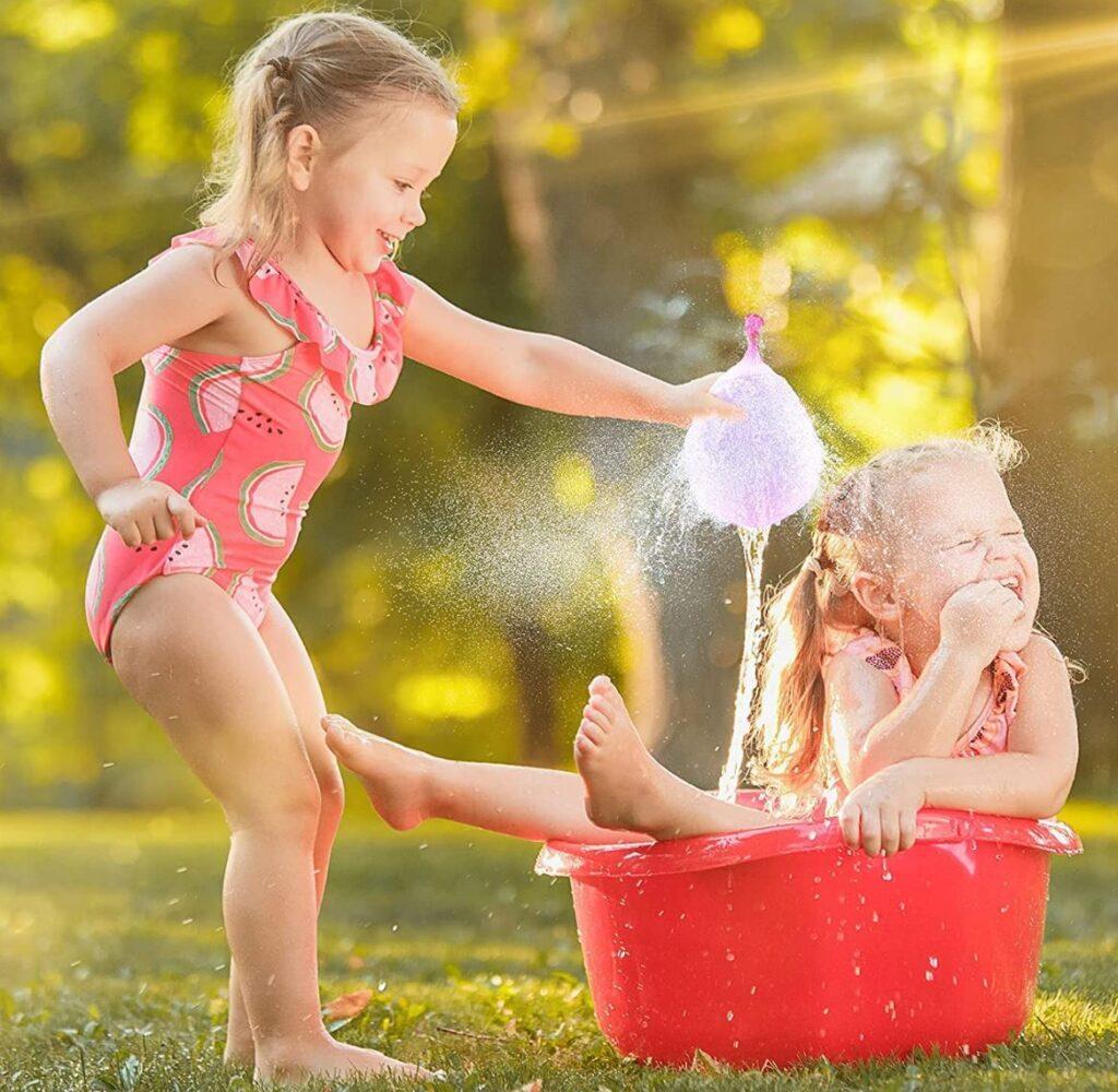 image of girl with water balloon