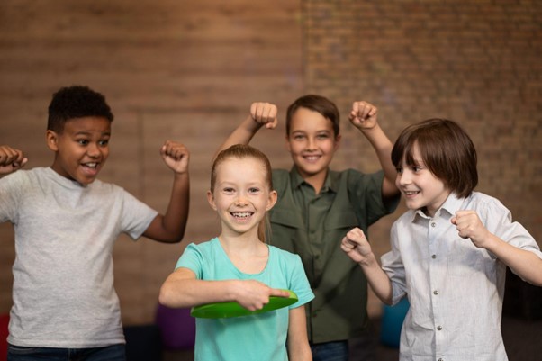 Four kids dancing